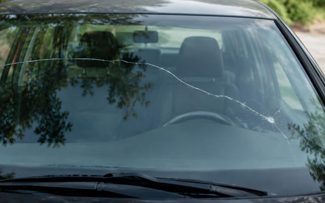 A crack running across a car windshield